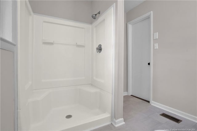 bathroom featuring walk in shower