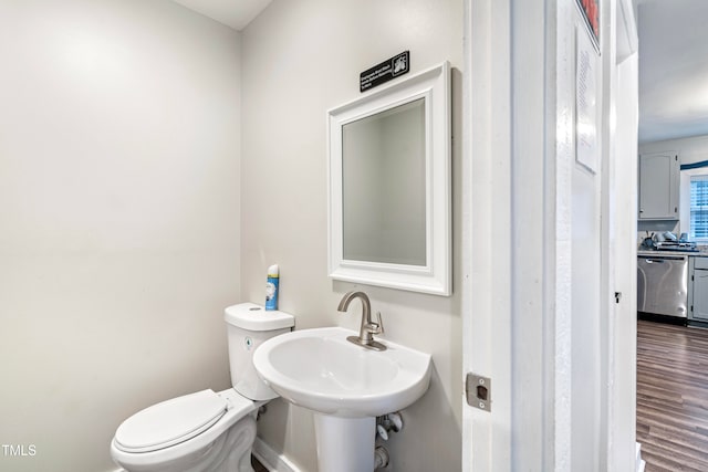 bathroom with sink, wood-type flooring, and toilet