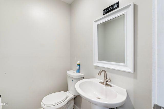 bathroom with sink and toilet