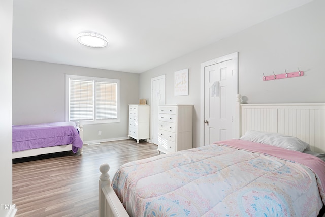 bedroom with hardwood / wood-style flooring