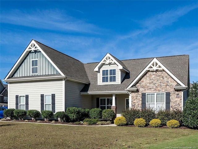 craftsman-style house with a front lawn