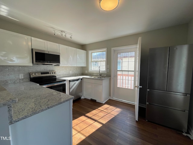 kitchen with white cabinetry, sink, dark hardwood / wood-style floors, and stainless steel appliances