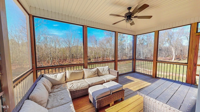 unfurnished sunroom with ceiling fan and wood ceiling