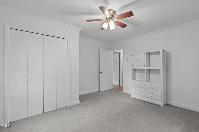 unfurnished bedroom with ceiling fan, crown molding, and light carpet