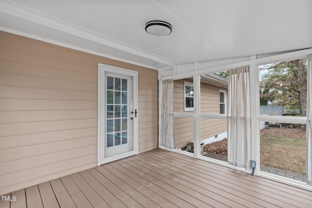 unfurnished sunroom with a wealth of natural light