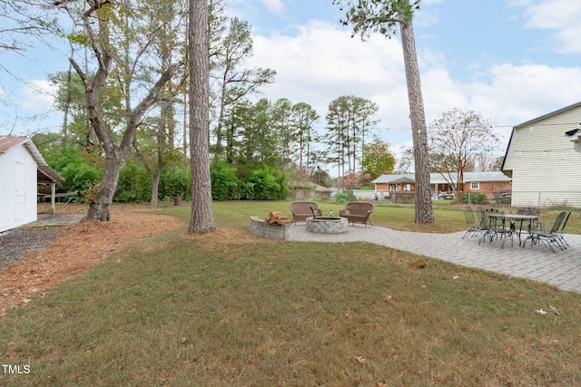 view of yard with a patio area and a fire pit