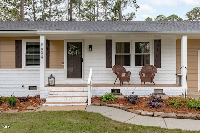 ranch-style home featuring covered porch