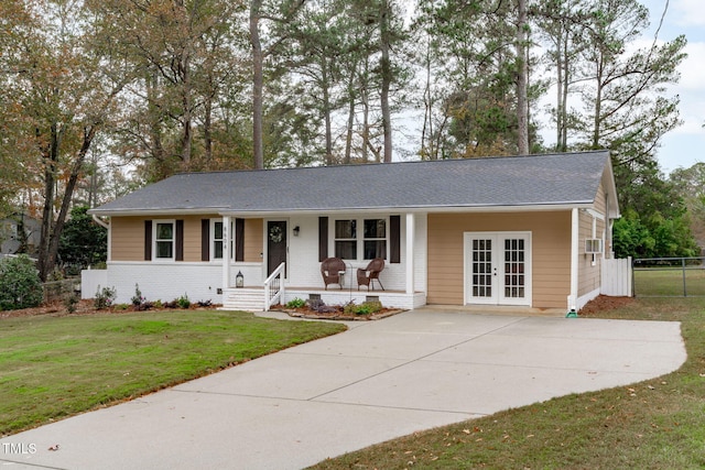 ranch-style house featuring a front yard, french doors, and a porch