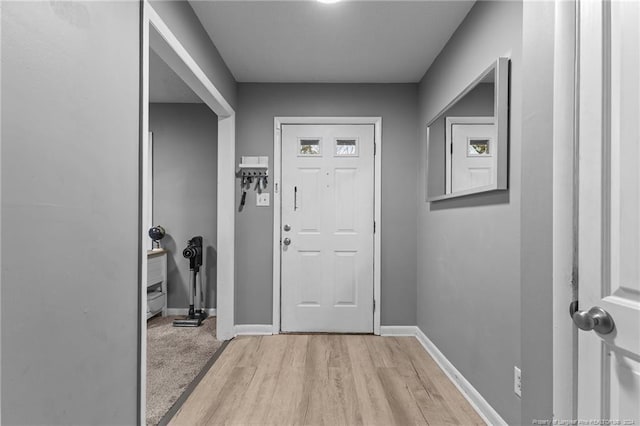 doorway to outside featuring light wood-type flooring