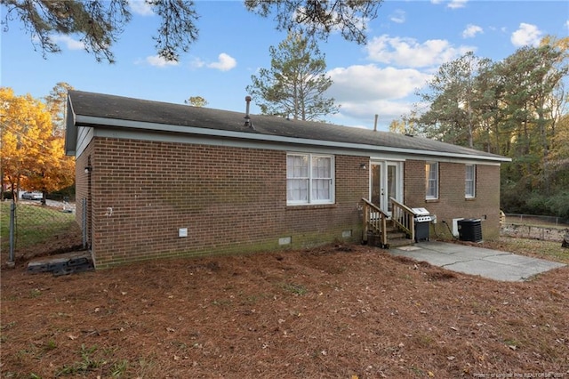 back of property with a patio and central air condition unit