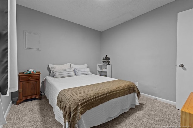 carpeted bedroom with a textured ceiling