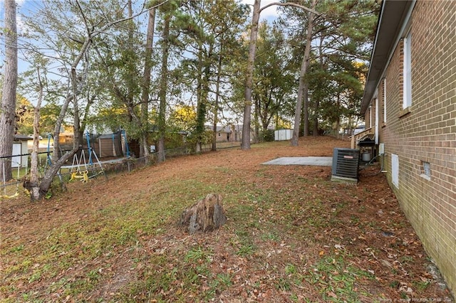 view of yard featuring central air condition unit