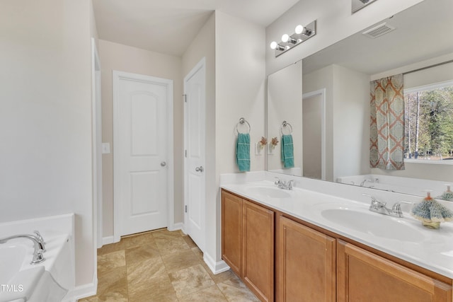 bathroom with vanity and a bathtub