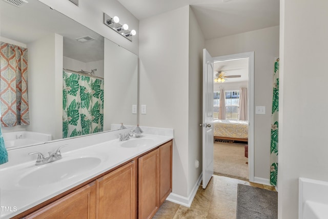 bathroom featuring tile patterned floors, ceiling fan, and vanity