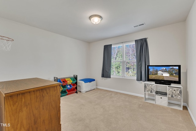 game room featuring light colored carpet