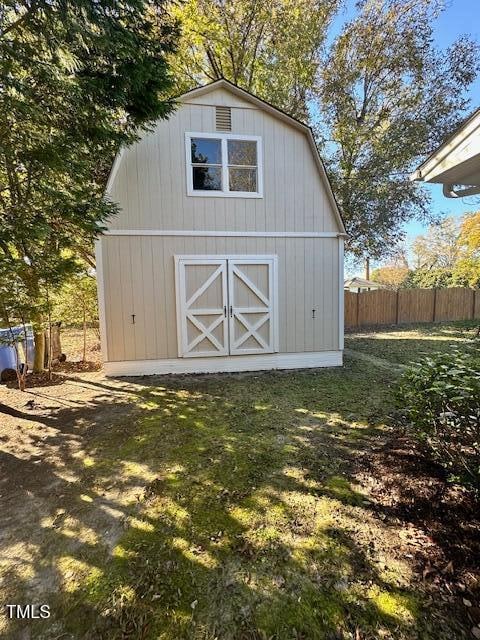 view of outdoor structure featuring a lawn