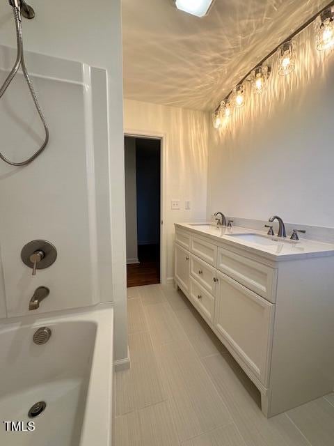 bathroom with vanity and shower / tub combination