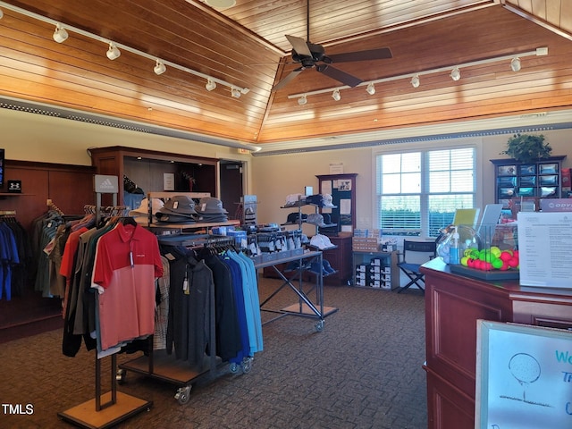 misc room featuring wood ceiling, track lighting, lofted ceiling, and dark carpet