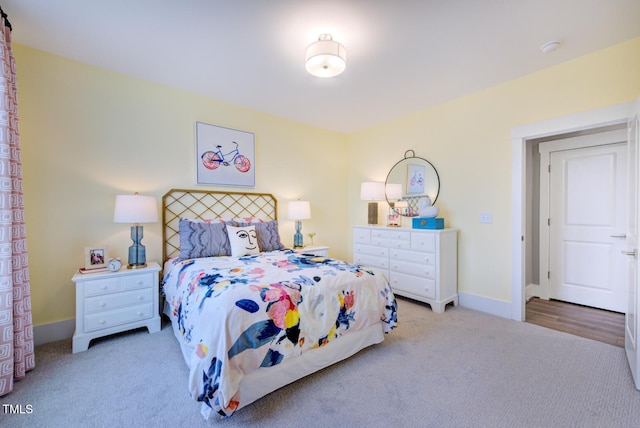 bedroom with light colored carpet