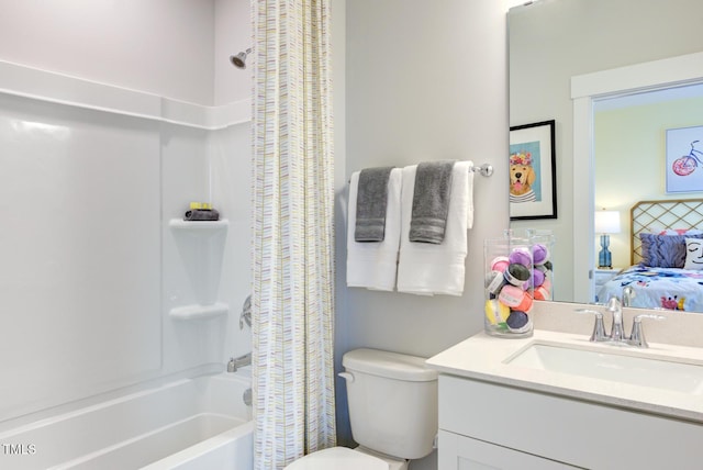 full bathroom with vanity, shower / bath combination with curtain, and toilet