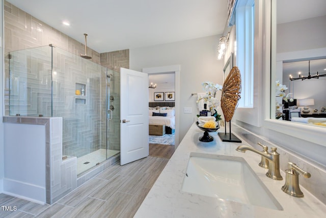 bathroom with vanity and an enclosed shower