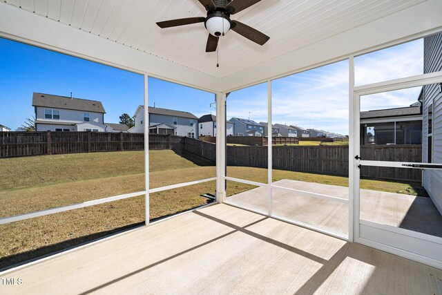 sunroom featuring ceiling fan