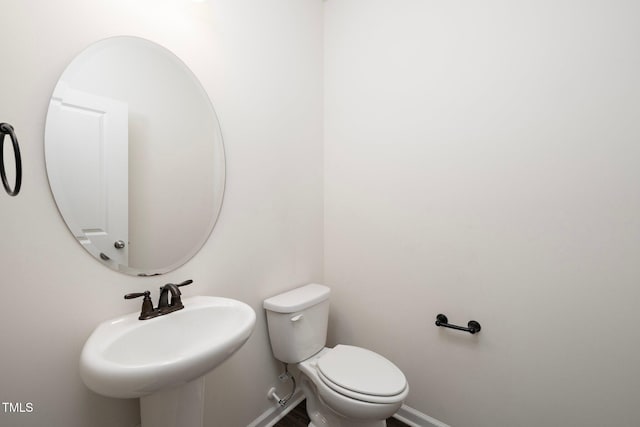 bathroom with sink and toilet