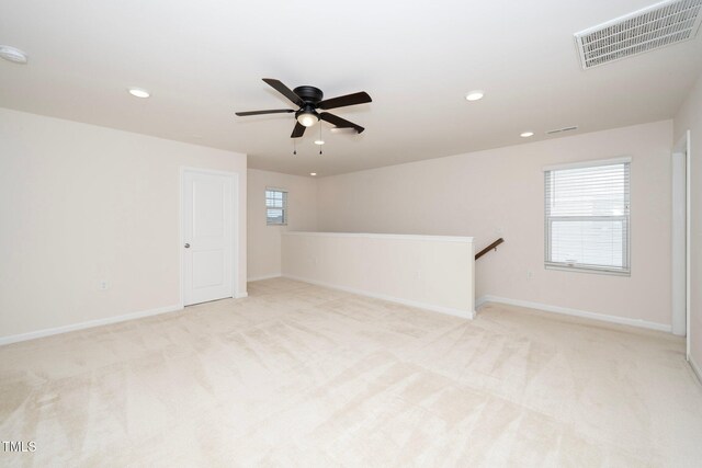 carpeted empty room with ceiling fan