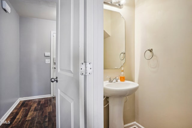 bathroom with wood-type flooring