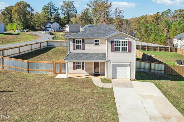 view of front facade with a front yard, a garage, and a patio area