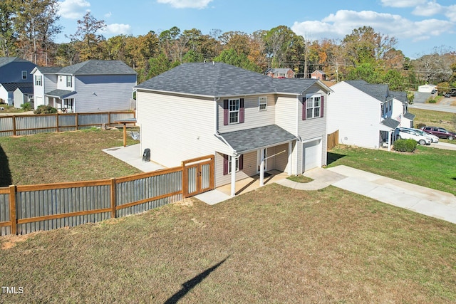 view of front facade with a front yard and a garage