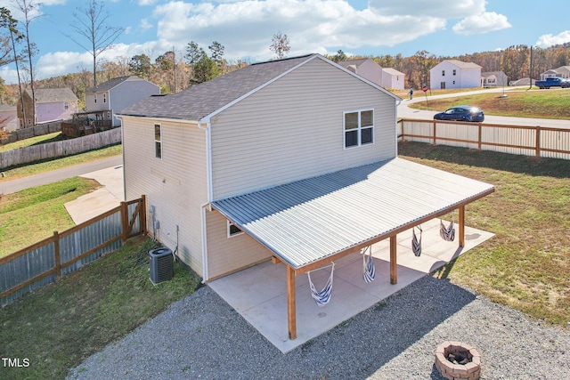 exterior space with a patio area and a lawn