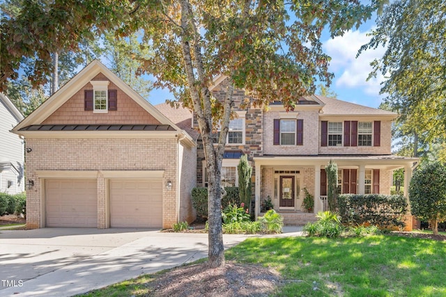 craftsman-style home featuring a garage and a front yard