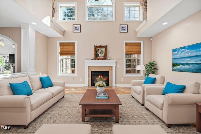 living room featuring a high ceiling and a wealth of natural light