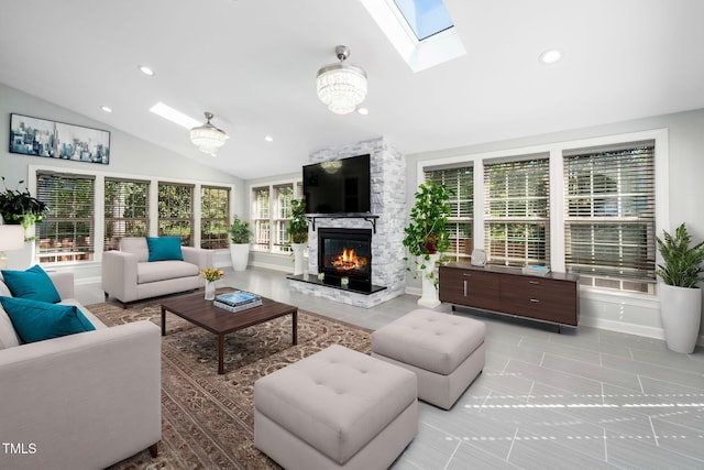 living room with light tile patterned floors, plenty of natural light, lofted ceiling, and a premium fireplace