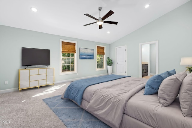 bedroom featuring carpet flooring, connected bathroom, ceiling fan, and vaulted ceiling