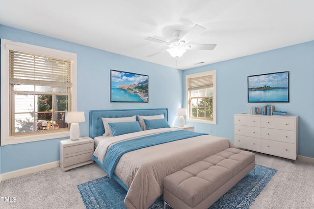 carpeted bedroom with ceiling fan