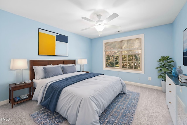 bedroom featuring ceiling fan and light colored carpet