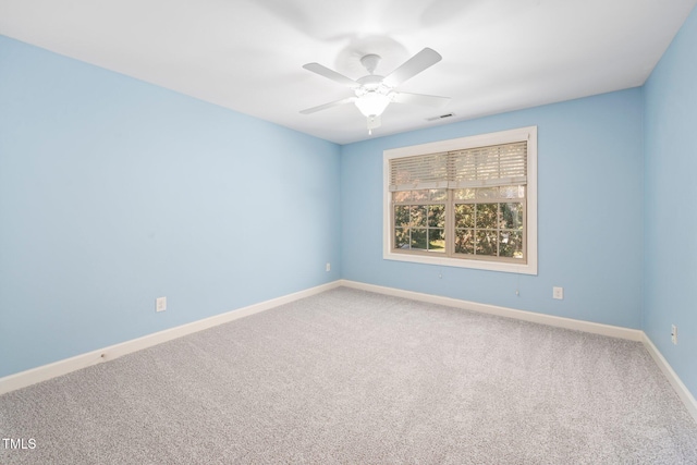 empty room with carpet flooring and ceiling fan