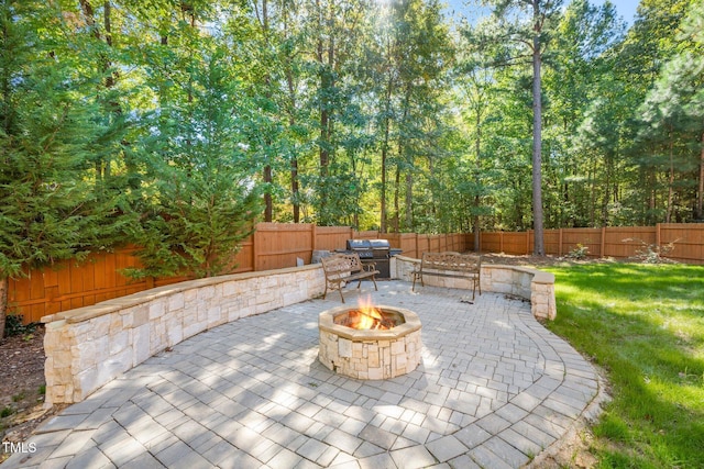 view of patio with an outdoor fire pit