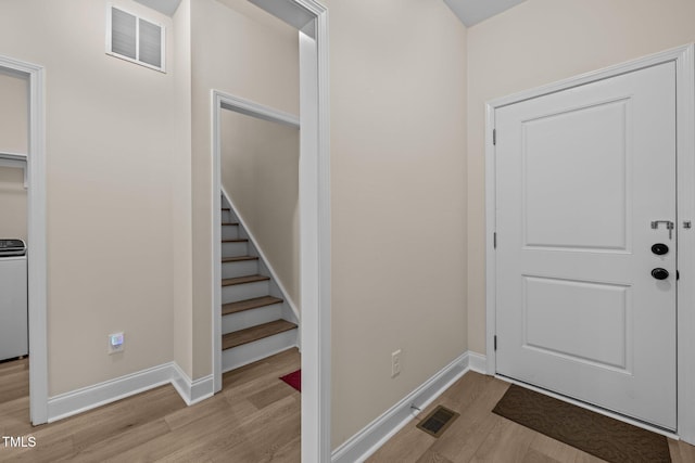 entryway with light hardwood / wood-style flooring