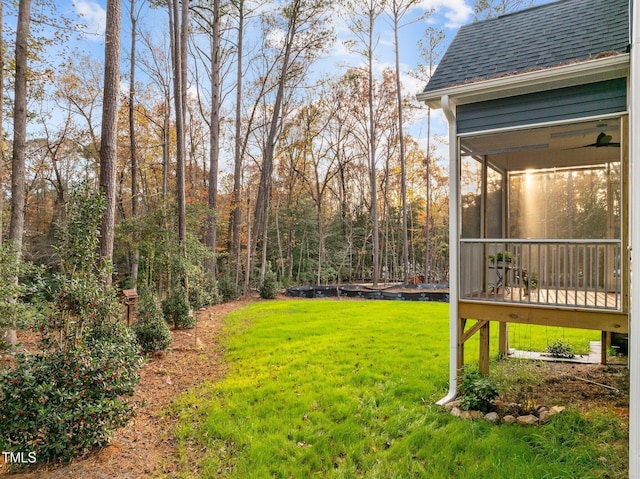 view of yard featuring a sunroom