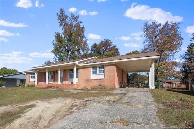 ranch-style home featuring a carport