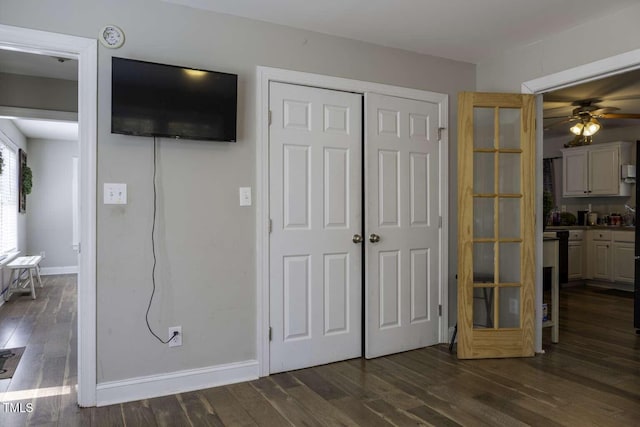 unfurnished bedroom featuring dark hardwood / wood-style floors and ceiling fan