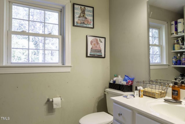 bathroom featuring vanity and toilet