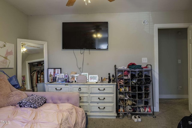 carpeted bedroom featuring a closet and ceiling fan