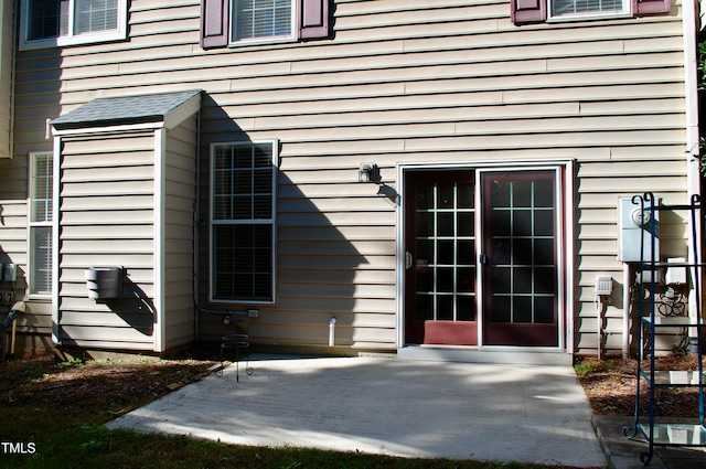 entrance to property featuring a patio