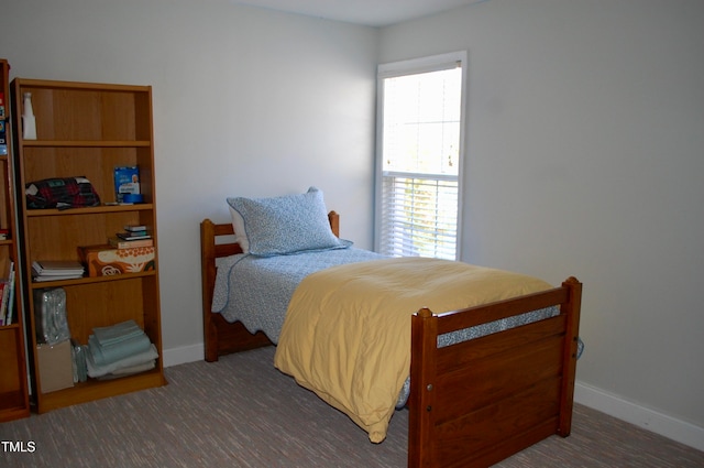 bedroom featuring baseboards