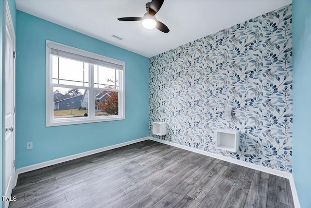 unfurnished room featuring hardwood / wood-style flooring and ceiling fan