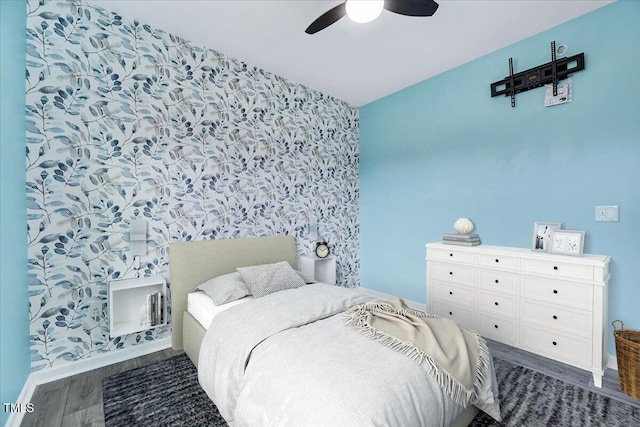 bedroom with hardwood / wood-style flooring and ceiling fan